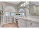 Stylish bathroom with a vanity, large mirror, and modern finishes creating a luxurious experience at 7761 Cowboy Trl, Las Vegas, NV 89131