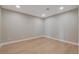 A serene room showcasing sleek hardwood floors and neutral walls, illuminated by recessed lighting at 7761 Cowboy Trl, Las Vegas, NV 89131