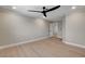 A bright and spacious bedroom with hardwood floors and an adjacent door to another room at 7761 Cowboy Trl, Las Vegas, NV 89131