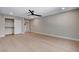 Spacious bedroom features light wood flooring, ceiling fan, and large closet at 7761 Cowboy Trl, Las Vegas, NV 89131