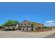 Spacious home featuring three garage doors and beautiful landscaping at 7761 Cowboy Trl, Las Vegas, NV 89131