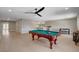 Bright game room with a pool table, custom bar, and ample space for entertaining at 7761 Cowboy Trl, Las Vegas, NV 89131