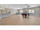 Expansive game room featuring a pool table, bar area, and plenty of natural light at 7761 Cowboy Trl, Las Vegas, NV 89131