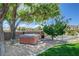 Relax in this secluded backyard hot tub surrounded by lush greenery and a serene atmosphere at 7761 Cowboy Trl, Las Vegas, NV 89131