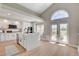 Open kitchen design with a large island, stainless appliances, and access to a sunny outdoor space at 7761 Cowboy Trl, Las Vegas, NV 89131