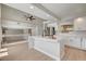 Modern kitchen featuring an island, stainless steel appliances and sleek white cabinetry at 7761 Cowboy Trl, Las Vegas, NV 89131
