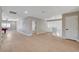 Spacious living room featuring hardwood floors and neutral paint, with a view of the stairs at 7761 Cowboy Trl, Las Vegas, NV 89131
