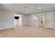 Inviting living area featuring hardwood floors, recessed lighting, and an open layout connecting to other rooms at 7761 Cowboy Trl, Las Vegas, NV 89131