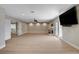 An expansive living room with a fireplace, hardwood floors, and plenty of natural light at 7761 Cowboy Trl, Las Vegas, NV 89131