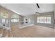 Bright, open living room features large windows and a distinctive railing, perfect for entertaining at 7761 Cowboy Trl, Las Vegas, NV 89131