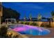 An inviting swimming pool illuminated at night at 7761 Cowboy Trl, Las Vegas, NV 89131