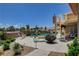 This backyard features a beautiful pool, landscaping, and spiral staircase leading to the upper level at 7761 Cowboy Trl, Las Vegas, NV 89131