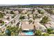 Aerial view of a community showcasing the home's backyard pool and tiled roofs at 8428 Apple Hill Ct, Las Vegas, NV 89128