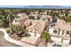An aerial view showcases the home's tiled roof and landscaping in its neighborhood setting at 8428 Apple Hill Ct, Las Vegas, NV 89128