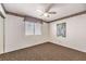 Bedroom with neutral walls, carpeted floor, and ceiling fan at 8428 Apple Hill Ct, Las Vegas, NV 89128