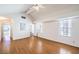 Large bedroom with hardwood floors and multiple windows leading to an ensuite bathroom with a sunken tub at 8428 Apple Hill Ct, Las Vegas, NV 89128
