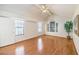 Bright bedroom with hardwood floors, ceiling fan, vaulted ceiling, and windows offering ample natural light at 8428 Apple Hill Ct, Las Vegas, NV 89128