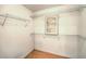 Walk-in closet featuring wire shelving and wood flooring at 8428 Apple Hill Ct, Las Vegas, NV 89128