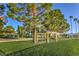 Scenic community park view featuring picnic benches, mature trees, and green grass at 8428 Apple Hill Ct, Las Vegas, NV 89128