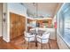 Cozy dining area featuring modern chandelier, a dining table, and tiled flooring at 8428 Apple Hill Ct, Las Vegas, NV 89128