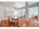 Open dining area with hardwood floors, chandelier, and easy access to other rooms at 8428 Apple Hill Ct, Las Vegas, NV 89128