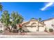 Charming single-story home featuring a three-car garage and desert landscaping at 8428 Apple Hill Ct, Las Vegas, NV 89128