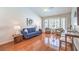 Comfortable living room with hardwood floors, vaulted ceiling, and bay window at 8428 Apple Hill Ct, Las Vegas, NV 89128