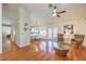 Open-concept living room with hardwood flooring, neutral paint, and modern furnishings for comfortable living and entertaining at 8428 Apple Hill Ct, Las Vegas, NV 89128