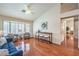 Bright living room with hardwood floors, vaulted ceiling, and bay window at 8428 Apple Hill Ct, Las Vegas, NV 89128