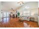 Spacious living room with vaulted ceilings, fireplace, and hardwood floors at 8428 Apple Hill Ct, Las Vegas, NV 89128