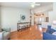 Spacious living room featuring vaulted ceiling, hardwood floors, and open floor plan at 8428 Apple Hill Ct, Las Vegas, NV 89128
