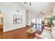 Bright living room features hardwood flooring, high ceilings, comfortable seating, and access to the backyard through glass doors at 8428 Apple Hill Ct, Las Vegas, NV 89128