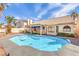 Beautiful backyard with a refreshing pool, palm trees, and a covered patio area at 8428 Apple Hill Ct, Las Vegas, NV 89128
