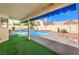 Outdoor living at its finest with a covered patio and a sparkling swimming pool at 8428 Apple Hill Ct, Las Vegas, NV 89128