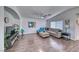 Spacious living room with vaulted ceilings, hard wood floors, and a comfortable, neutral-toned sofa at 8567 Little Fox St, Las Vegas, NV 89123