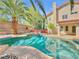 Gorgeous backyard showcasing a refreshing swimming pool, lush greenery, and ample space for entertaining and relaxation at 8632 Skyward Ct, Las Vegas, NV 89145