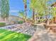 Beautiful backyard with a serene rock garden and calming water feature at 8632 Skyward Ct, Las Vegas, NV 89145