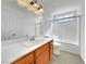 Well-lit bathroom with modern fixtures, vanity, and a glass-enclosed shower/tub, offering a clean design at 8632 Skyward Ct, Las Vegas, NV 89145