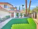 Two-story home with lush green lawn, mature trees, and a welcoming front entrance, creating a picturesque setting at 8632 Skyward Ct, Las Vegas, NV 89145