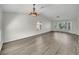 Spacious living room with hardwood floors, natural light, and elegant chandelier, perfect for comfortable living at 8632 Skyward Ct, Las Vegas, NV 89145