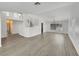 Open living room with sleek flooring, staircase and natural light; an airy space for comfortable living at 8632 Skyward Ct, Las Vegas, NV 89145