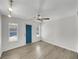 Versatile room with sleek flooring, ceiling fan, and door to outdoor, offering comfort and style at 8632 Skyward Ct, Las Vegas, NV 89145
