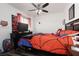 Fun bedroom with a superhero theme, wood-look floors, and a ceiling fan at 9029 Tumblewood Ave, Las Vegas, NV 89143