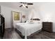 Charming bedroom with wood-look floors and a decorative canopy over the bed at 9029 Tumblewood Ave, Las Vegas, NV 89143