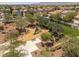 Community playground with slide and benches, set amongst trees in a neighborhood, all with views of mountains in the distance at 9029 Tumblewood Ave, Las Vegas, NV 89143