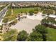 Community park featuring a sand volleyball court and an expansive grass field, with trees providing shade and greenery at 9029 Tumblewood Ave, Las Vegas, NV 89143