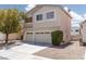 Charming two-story residence with a convenient three-car garage and neat landscaping at 9029 Tumblewood Ave, Las Vegas, NV 89143