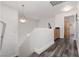 Upstairs hallway with hardwood floors, chandelier, leading to bedrooms at 9029 Tumblewood Ave, Las Vegas, NV 89143