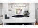 Bright kitchen featuring white countertops and blue cabinetry, with stainless steel appliances at 9029 Tumblewood Ave, Las Vegas, NV 89143