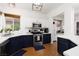 Stylish kitchen featuring navy cabinets, white countertops, stainless steel appliances, and wood flooring at 9029 Tumblewood Ave, Las Vegas, NV 89143